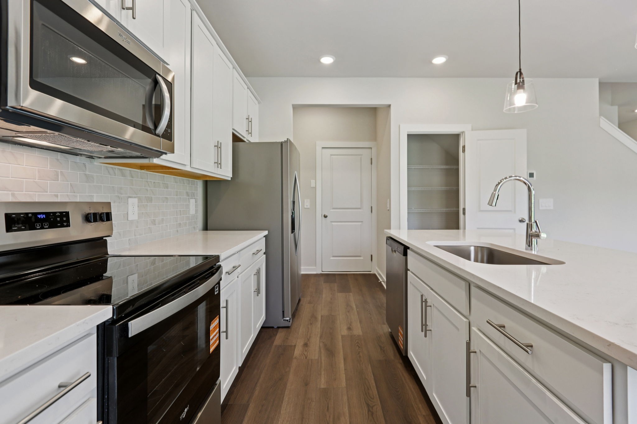 3823 Hallanday Drive Murfreesboro, TN 37128 - Photo 22 of 59 a kitchen with stainless steel appliances granite countertop a sink a stove oven a refrigerator with wooden cabinets and floor