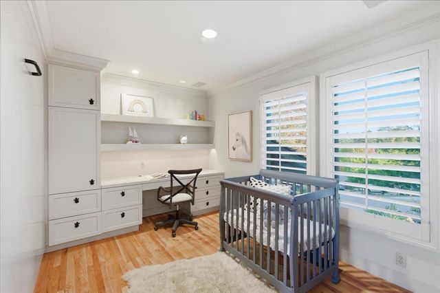 a bedroom with furniture and a window