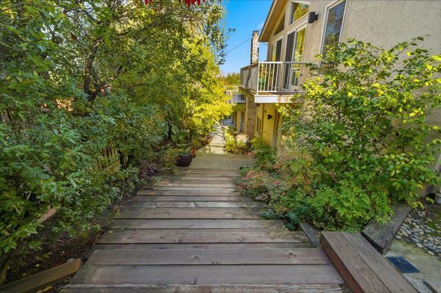 a view of a pathway of the house front of street