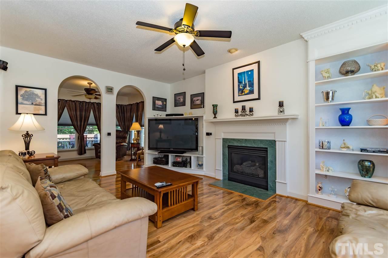 5232 Knightsbridge Way Raleigh, NC 27604 - Photo 5 of 25 a living room with furniture and a fireplace