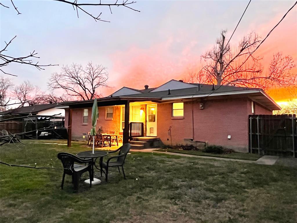 a view of a house with a yard porch and sitting area