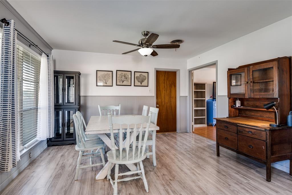 2602 Ridgecrest Drive Garland, TX 75041 - Photo 11 of 24 a view of a dining room with furniture window and wooden floor