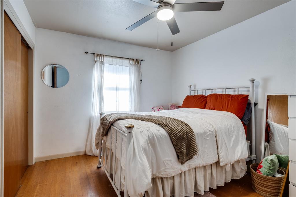 2602 Ridgecrest Drive Garland, TX 75041 - Photo 16 of 24 a bedroom with a bed and a window