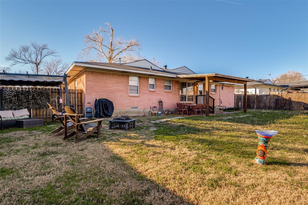 2602 Ridgecrest Drive Garland, TX 75041 - Photo 22 of 24 a view of a house with swimming pool and sitting area
