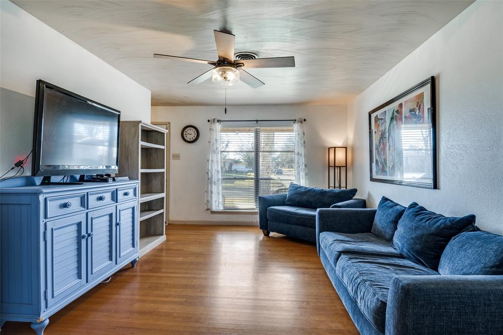 2602 Ridgecrest Drive Garland, TX 75041 - Photo 4 of 24 a living room with furniture and a flat screen tv