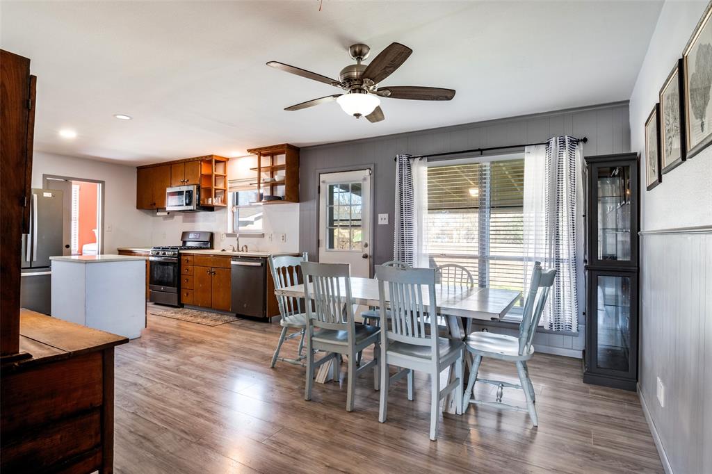 2602 Ridgecrest Drive Garland, TX 75041 - Photo 5 of 24 a view of kitchen with cabinets table and chairs