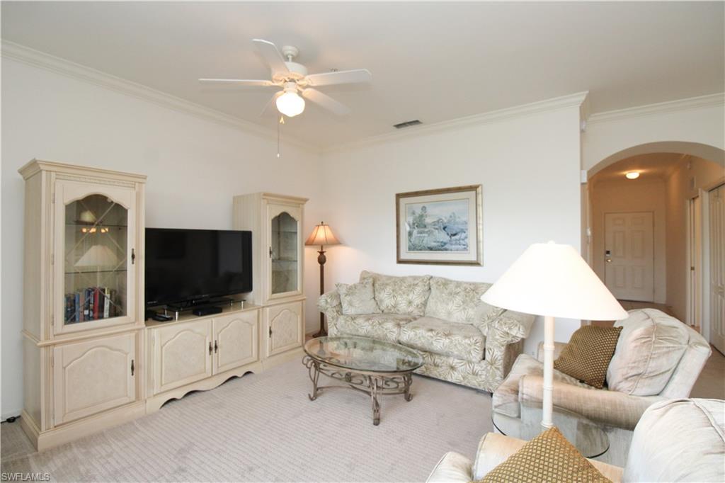 3820 Sawgrass Way, Unit 3046 Naples, FL 34112 - Photo 13 of 50 a living room with furniture and a flat screen tv