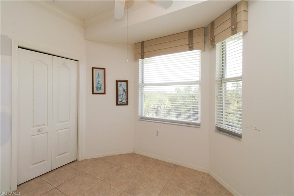 3820 Sawgrass Way, Unit 3046 Naples, FL 34112 - Photo 16 of 50 a view of an empty room with a window