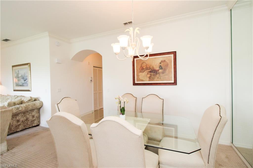 3820 Sawgrass Way, Unit 3046 Naples, FL 34112 - Photo 25 of 50 a bedroom with furniture and a window