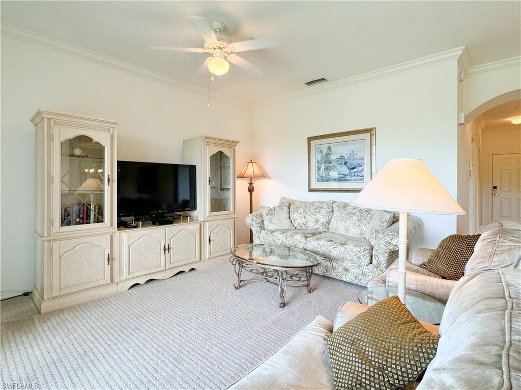 3820 Sawgrass Way, Unit 3046 Naples, FL 34112 - Photo 31 of 50 a living room with furniture and a flat screen tv