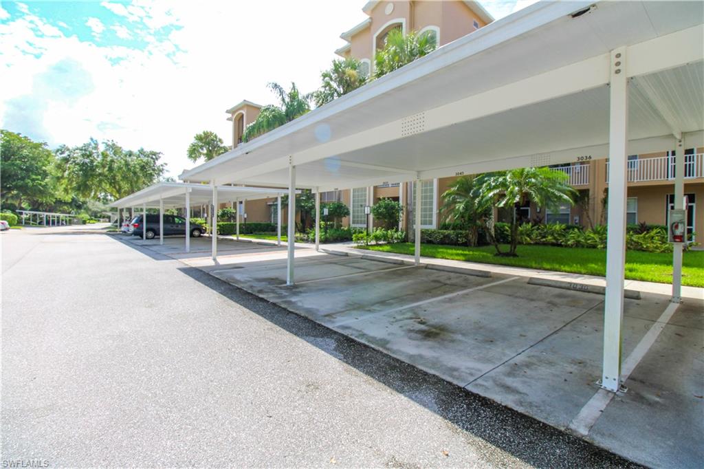 3820 Sawgrass Way, Unit 3046 Naples, FL 34112 - Photo 42 of 50 a view of a house with porch and garden