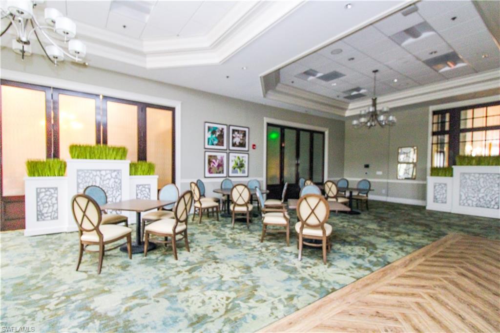 3820 Sawgrass Way, Unit 3046 Naples, FL 34112 - Photo 46 of 50 a living room with furniture and a large window