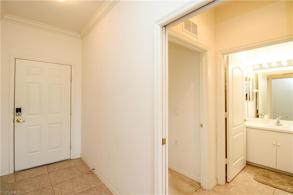 3820 Sawgrass Way, Unit 3046 Naples, FL 34112 - Photo 7 of 50 a view of a bathroom with mirror
