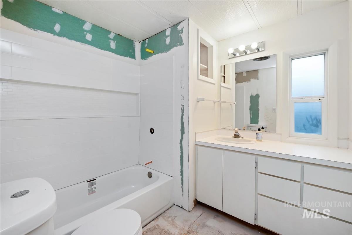 10167 Maymie Road Boise, ID 83714 - Photo 17 of 31 Full bathroom featuring bathing tub / shower combination and vanity