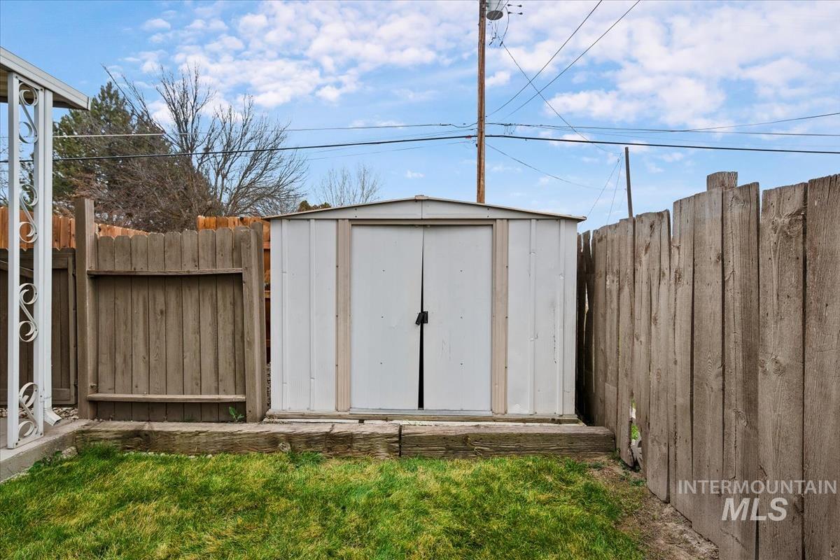 10167 Maymie Road Boise, ID 83714 - Photo 27 of 31 View of shed with a fenced backyard