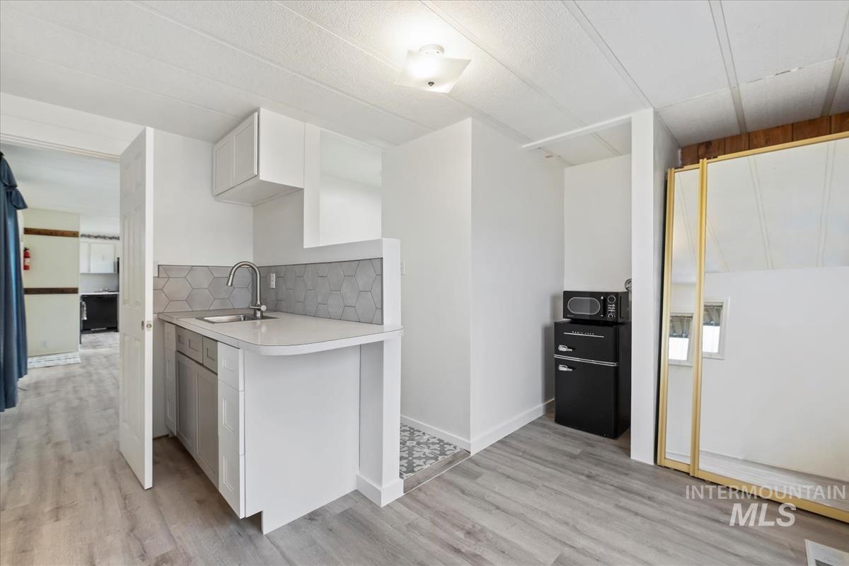 10167 Maymie Road Boise, ID 83714 - Photo 9 of 31 Bedroom 3 with kitchenette and laundry hookups and private full bathroom.