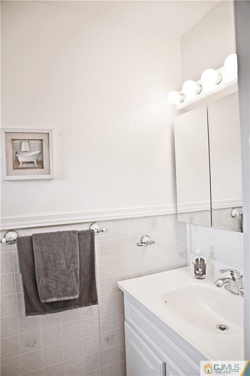 58 Princeton Road Old Bridge, NJ 08859 - Photo 12 of 24 a bathroom with a sink and a mirror