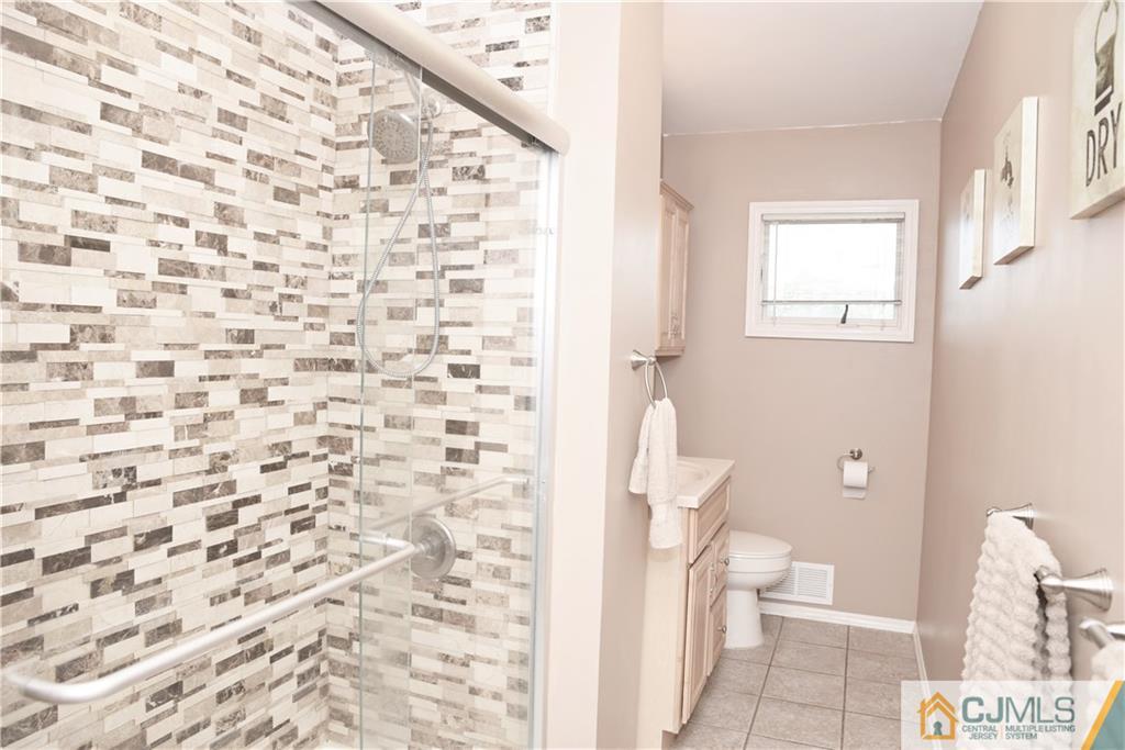 58 Princeton Road Old Bridge, NJ 08859 - Photo 14 of 24 a bathroom with a toilet and a shower curtain