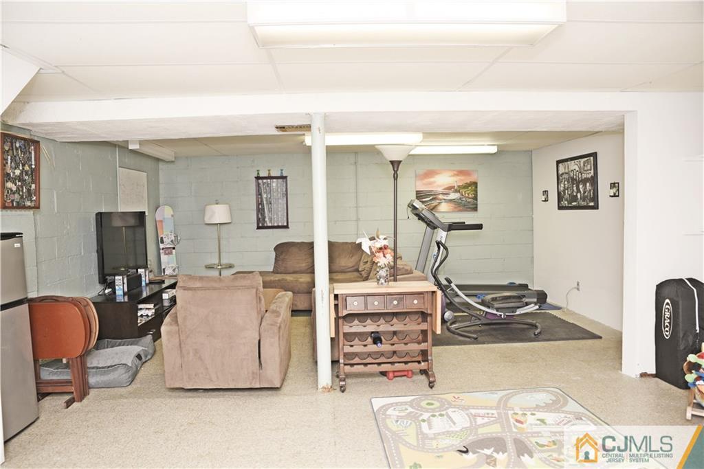 58 Princeton Road Old Bridge, NJ 08859 - Photo 18 of 24 a living room with furniture and a flat screen tv