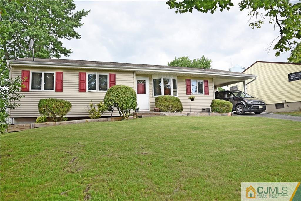 58 Princeton Road Old Bridge, NJ 08859 - Photo 3 of 24 a front view of a house with a garden