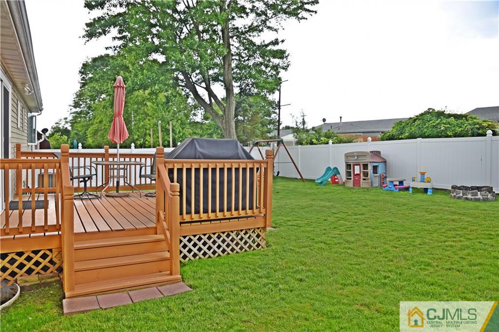 58 Princeton Road Old Bridge, NJ 08859 - Photo 22 of 24 a view of a deck with a yard