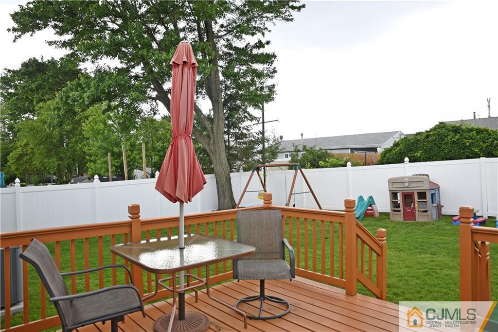 58 Princeton Road Old Bridge, NJ 08859 - Photo 23 of 24 a view of a patio with a table and chairs