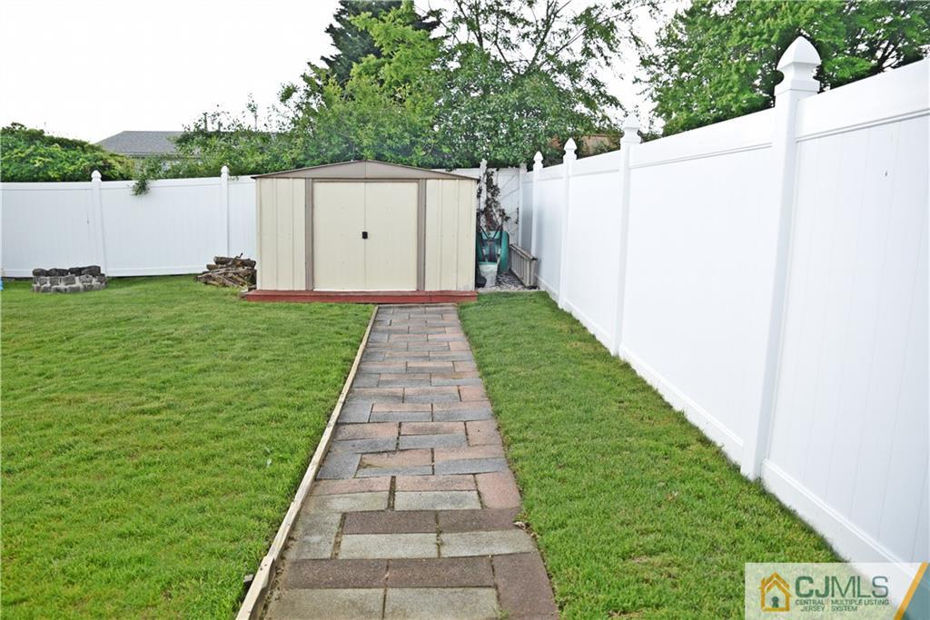 58 Princeton Road Old Bridge, NJ 08859 - Photo 24 of 24 a backyard of a house with lots of green space