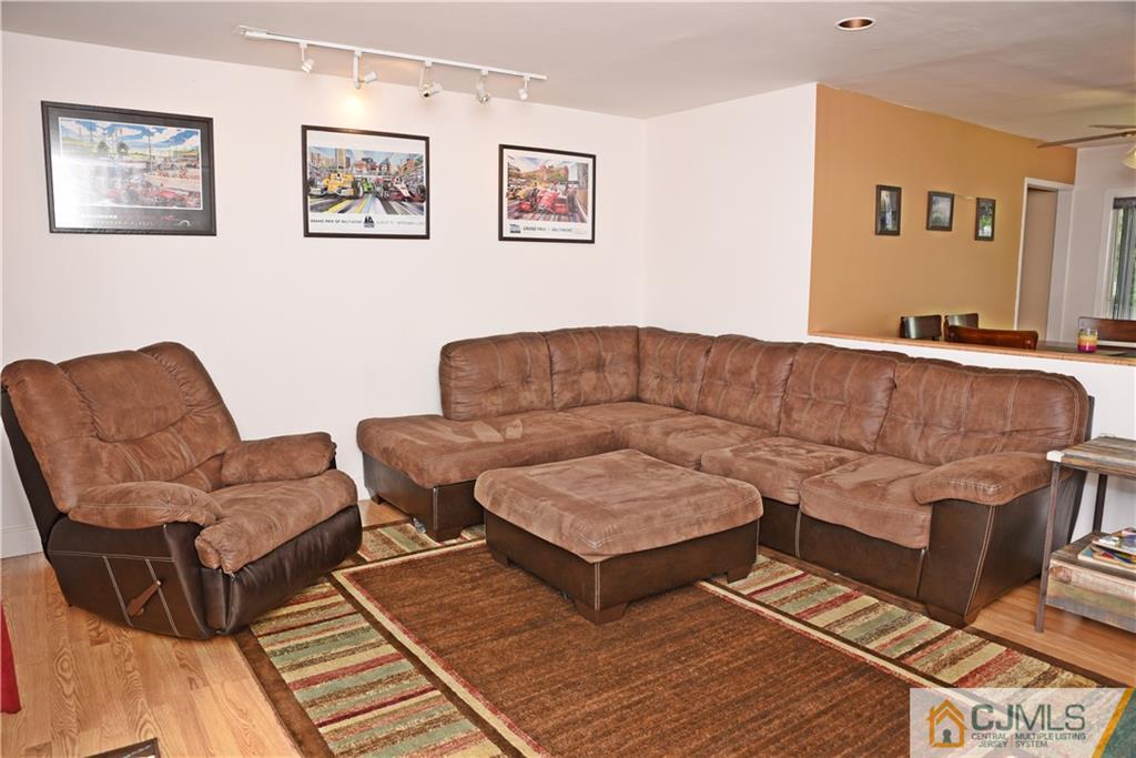 58 Princeton Road Old Bridge, NJ 08859 - Photo 4 of 24 a living room with couches and painting on the wall
