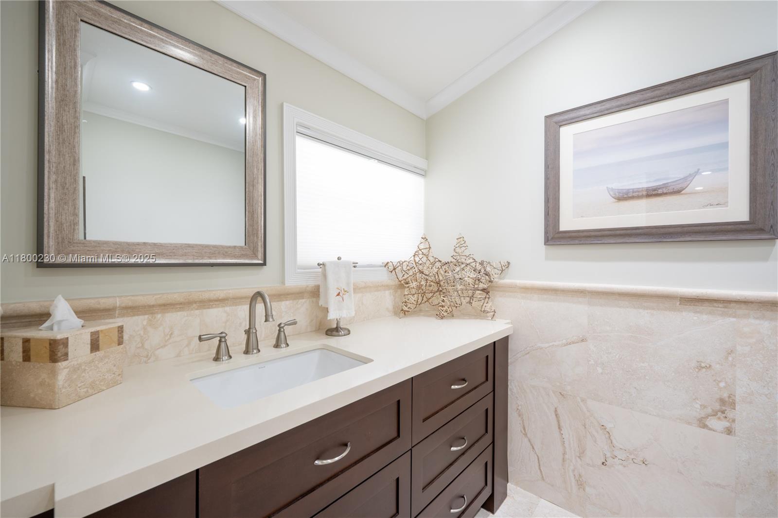 2855 Southwest 17th Avenue Miami, FL 33133 - Photo 16 of 84 a bathroom with a sink vanity and a mirror