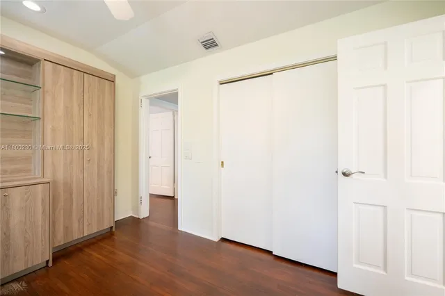 a bedroom with a bed and a view of bathroom