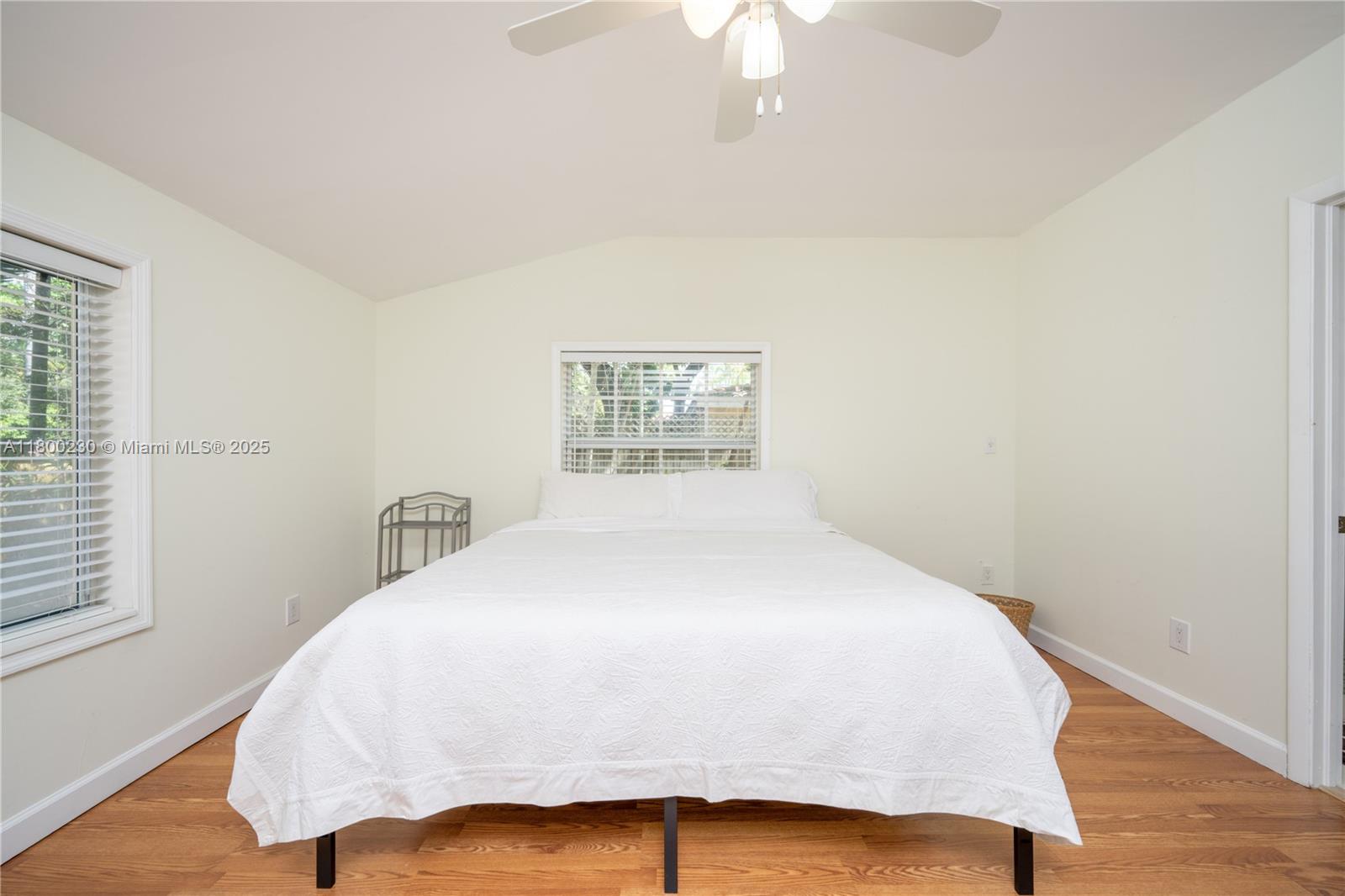 2855 Southwest 17th Avenue Miami, FL 33133 - Photo 27 of 84 a bedroom with a bed and a painting on the wall