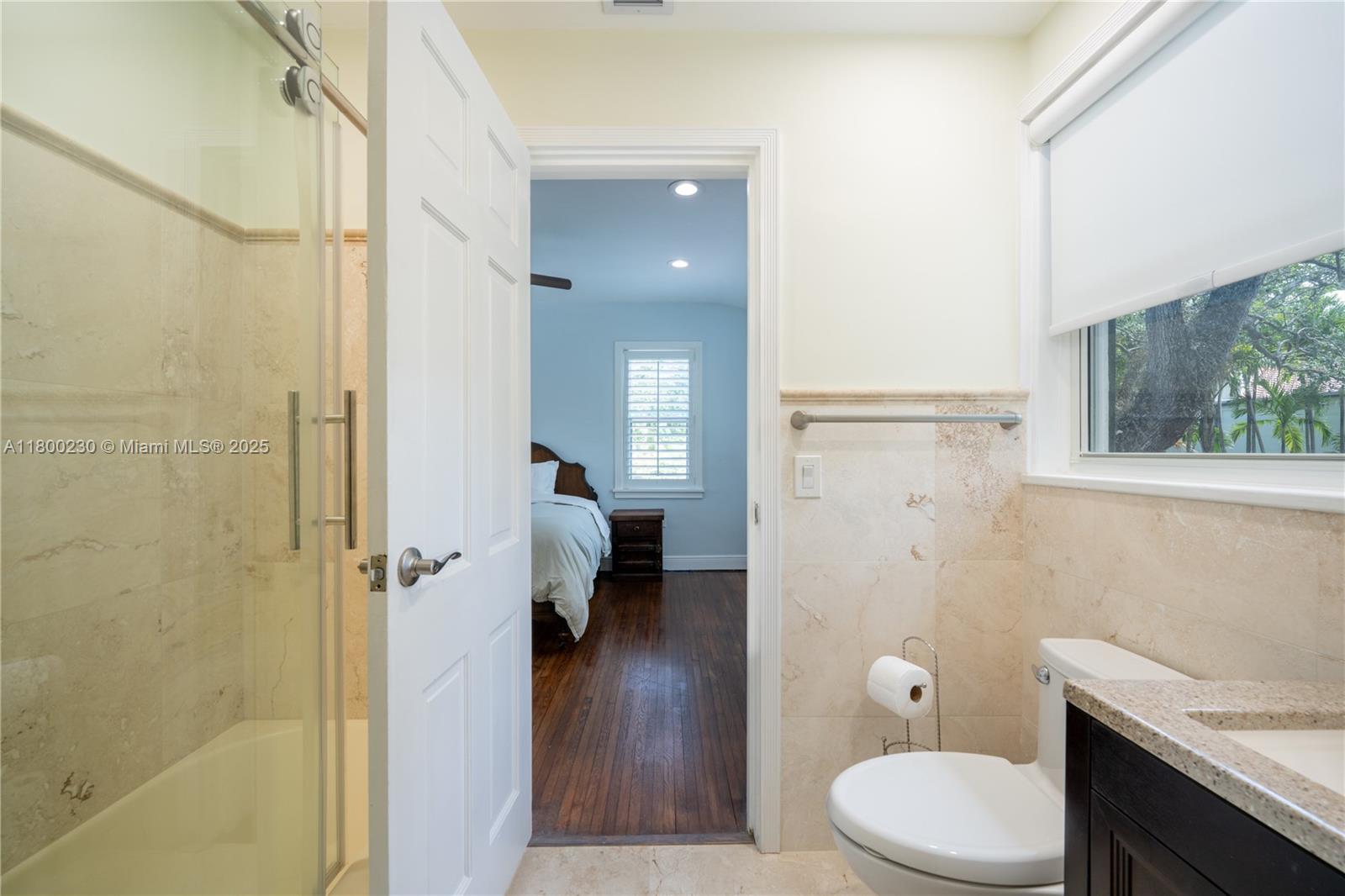 2855 Southwest 17th Avenue Miami, FL 33133 - Photo 29 of 84 a bathroom with a toilet a sink and shower