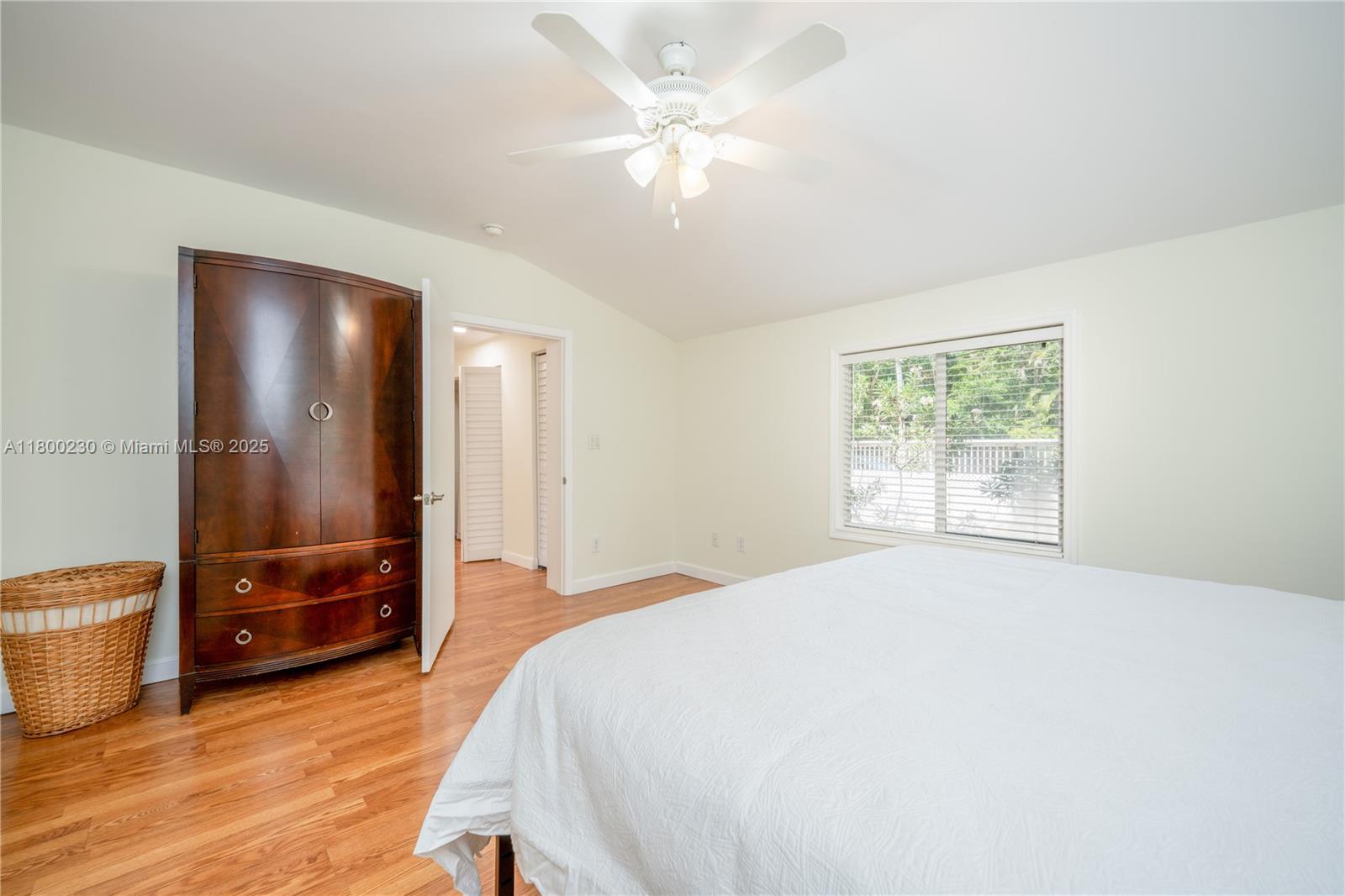 2855 Southwest 17th Avenue Miami, FL 33133 - Photo 34 of 84 a bedroom with a bed and a view of bathroom