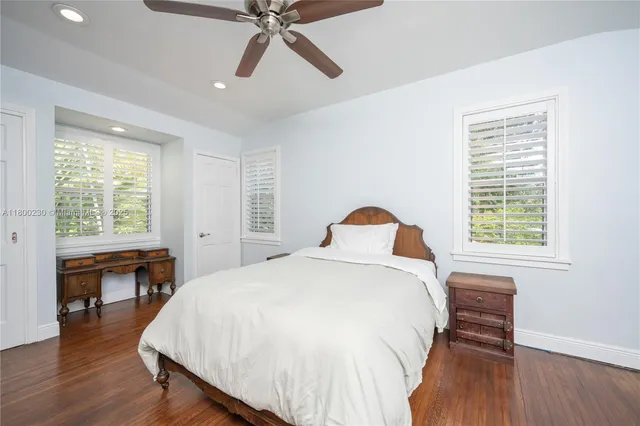 a living room with furniture and a large window with outer view