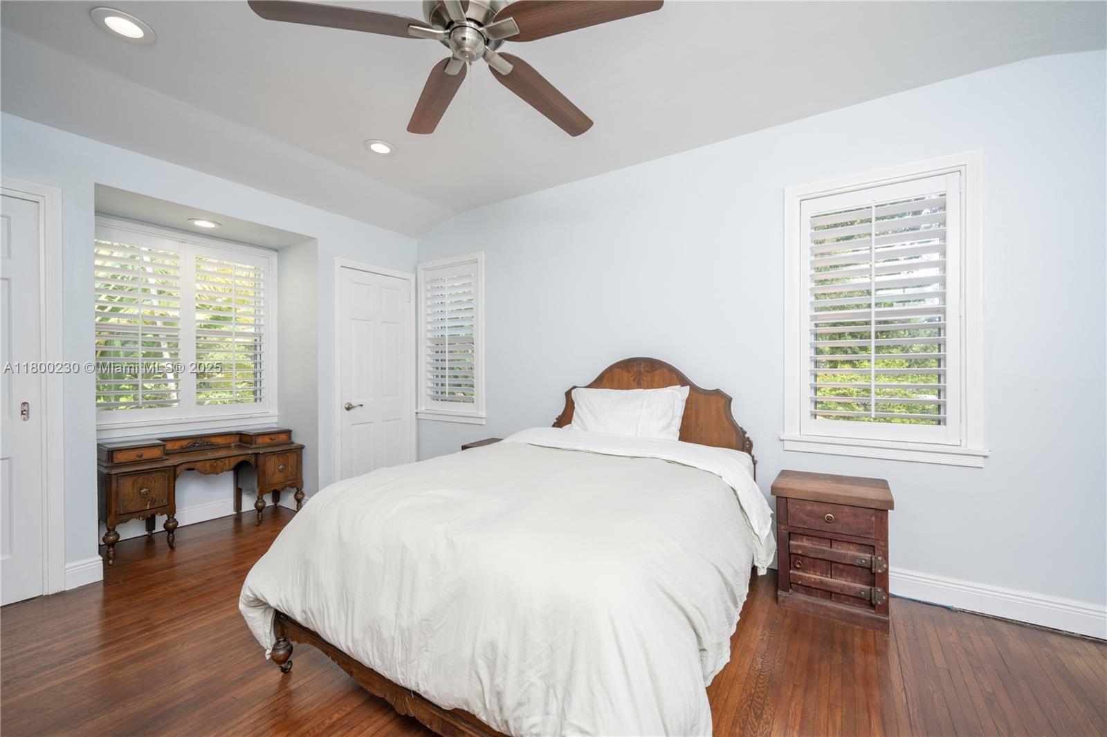 2855 Southwest 17th Avenue Miami, FL 33133 - Photo 36 of 84 a bedroom with a bed and a wooden floor