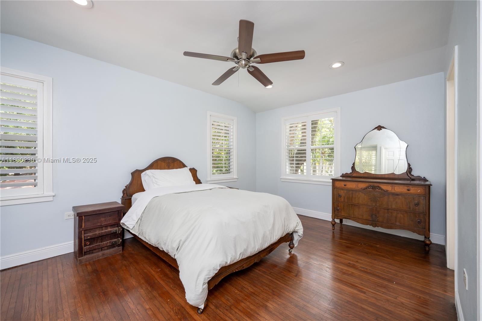 2855 Southwest 17th Avenue Miami, FL 33133 - Photo 38 of 84 a bedroom with a bed and wooden floor
