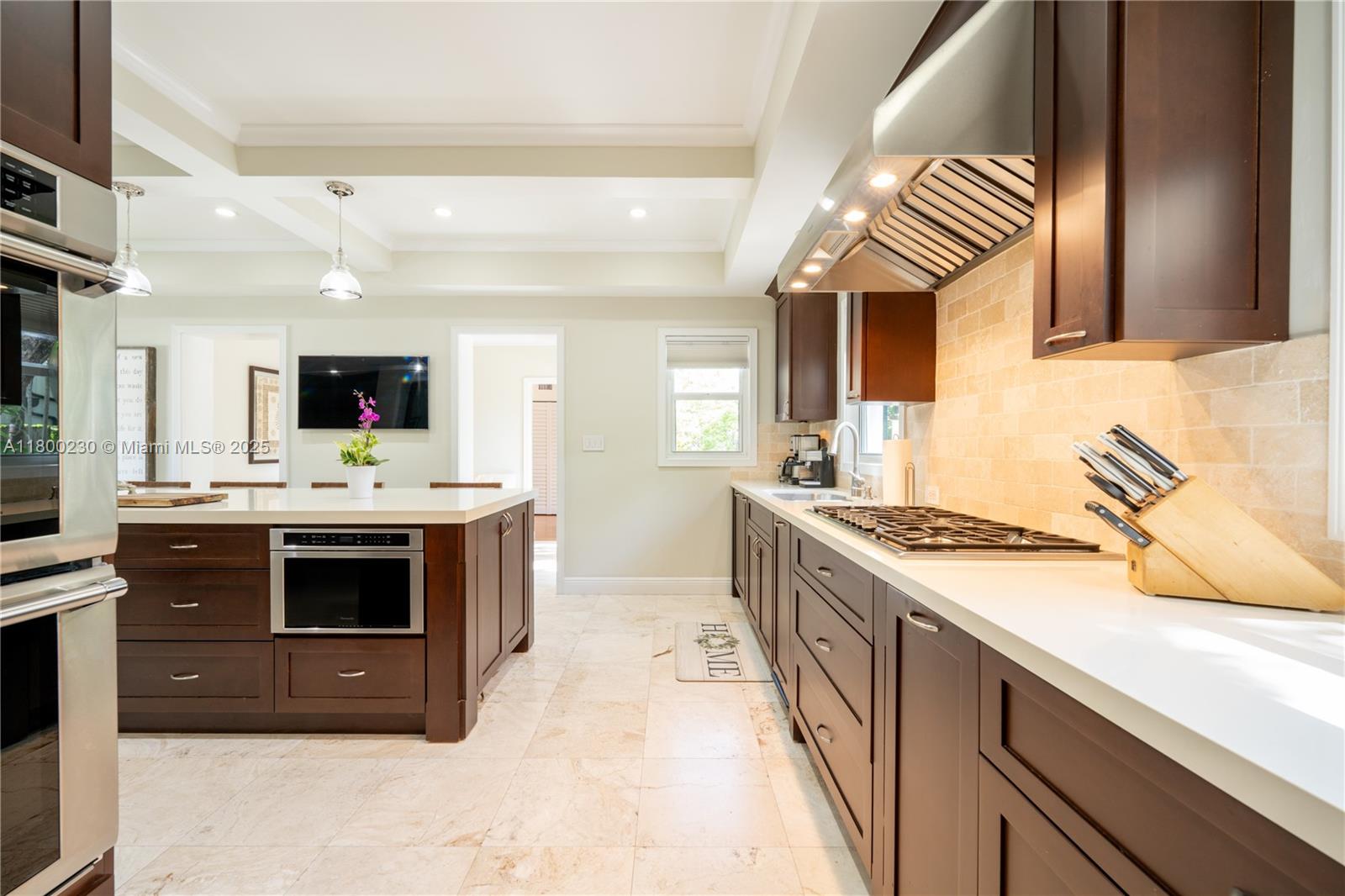 2855 Southwest 17th Avenue Miami, FL 33133 - Photo 40 of 84 a kitchen with stainless steel appliances a stove sink and cabinets