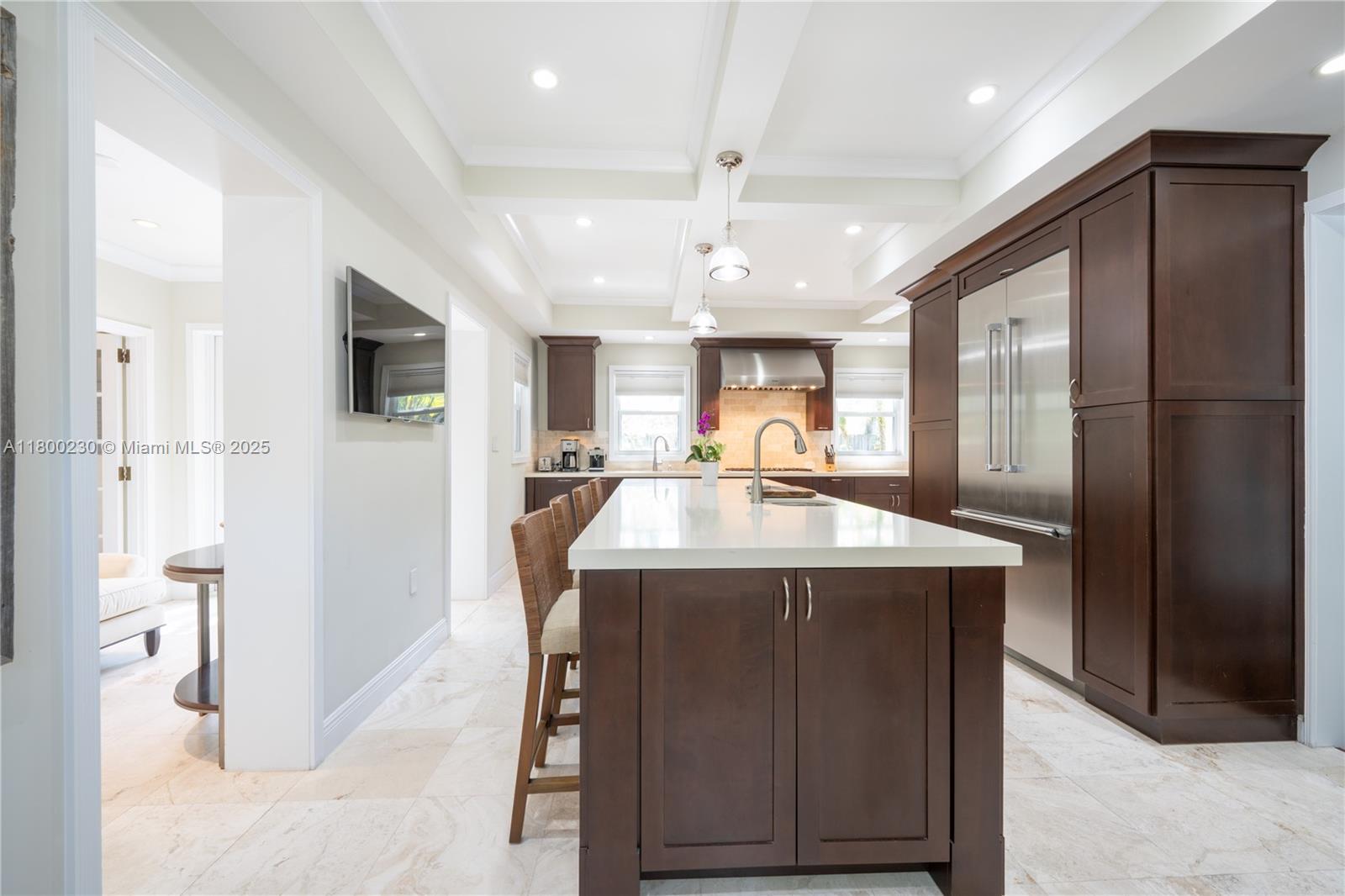 2855 Southwest 17th Avenue Miami, FL 33133 - Photo 4 of 84 a kitchen with kitchen island a sink stainless steel appliances and cabinets