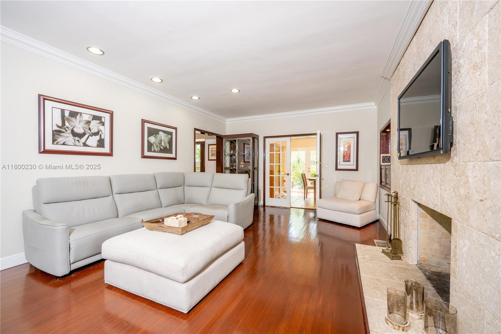 2855 Southwest 17th Avenue Miami, FL 33133 - Photo 57 of 84 a living room with furniture and a fireplace