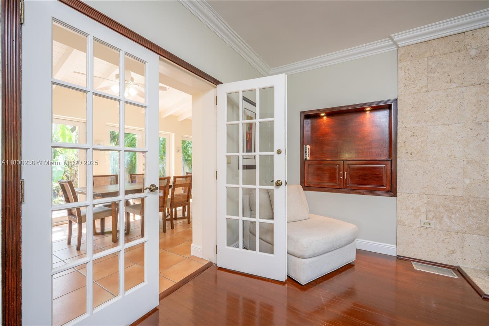 2855 Southwest 17th Avenue Miami, FL 33133 - Photo 59 of 84 Living Room's French Doors leading to the Florida Room