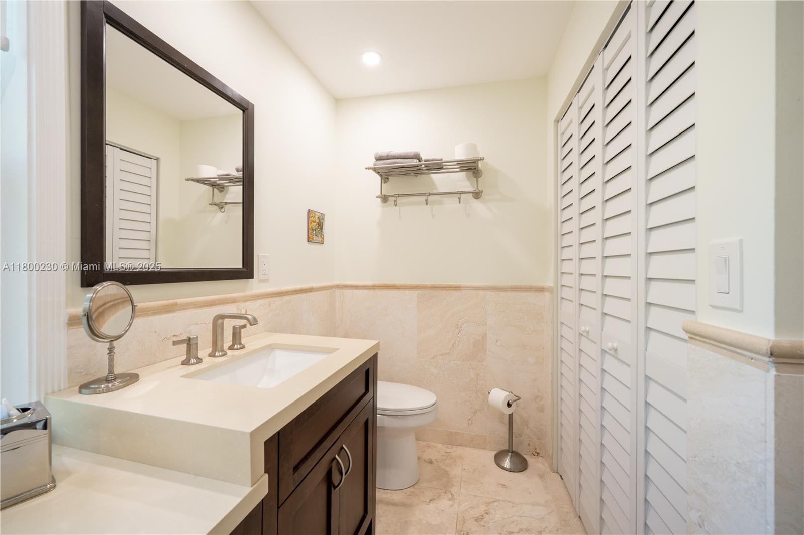 2855 Southwest 17th Avenue Miami, FL 33133 - Photo 6 of 84 a bathroom with a sink a toilet and mirror