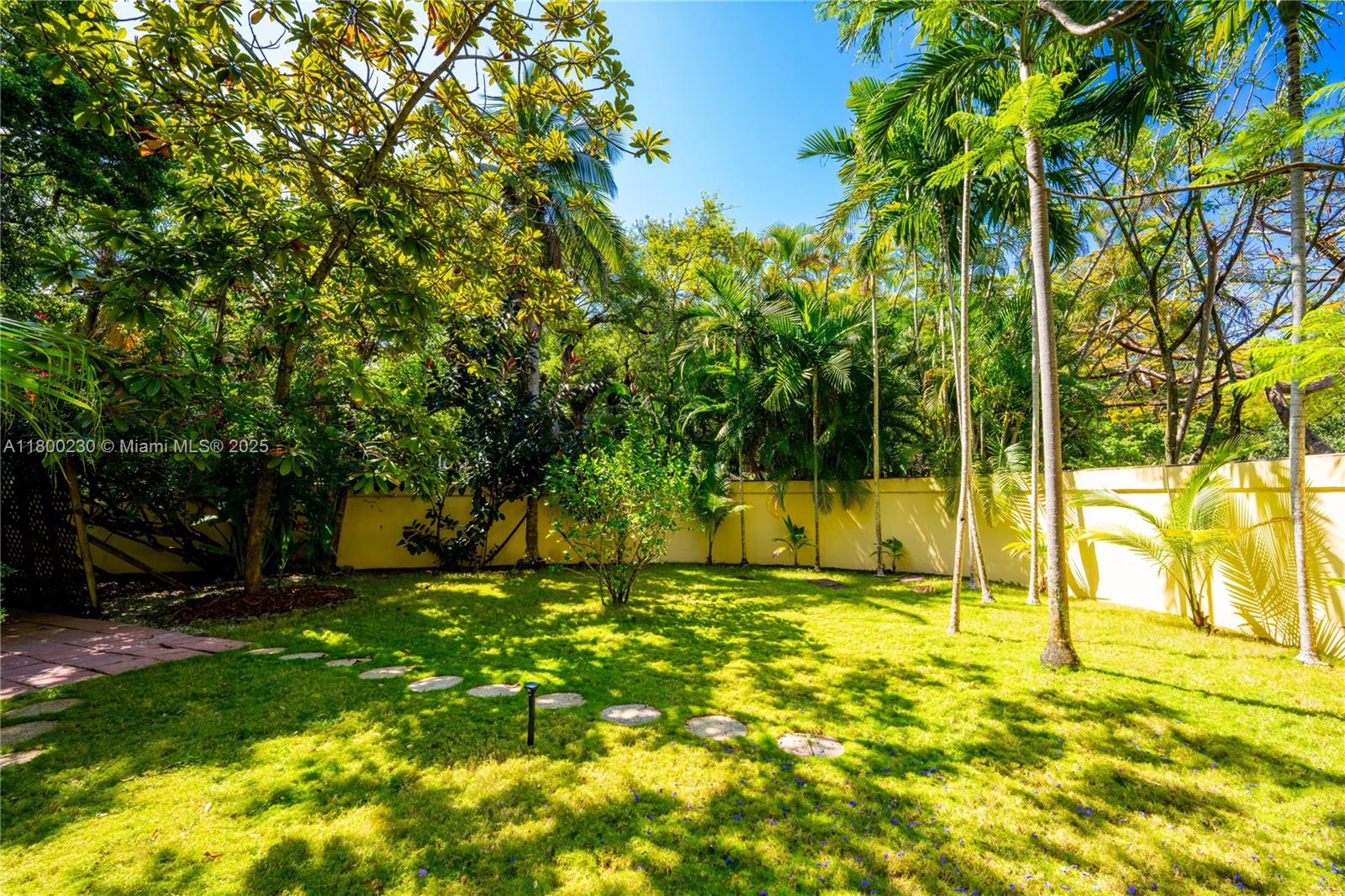 2855 Southwest 17th Avenue Miami, FL 33133 - Photo 74 of 84 a view of swimming pool with lawn chairs and large trees