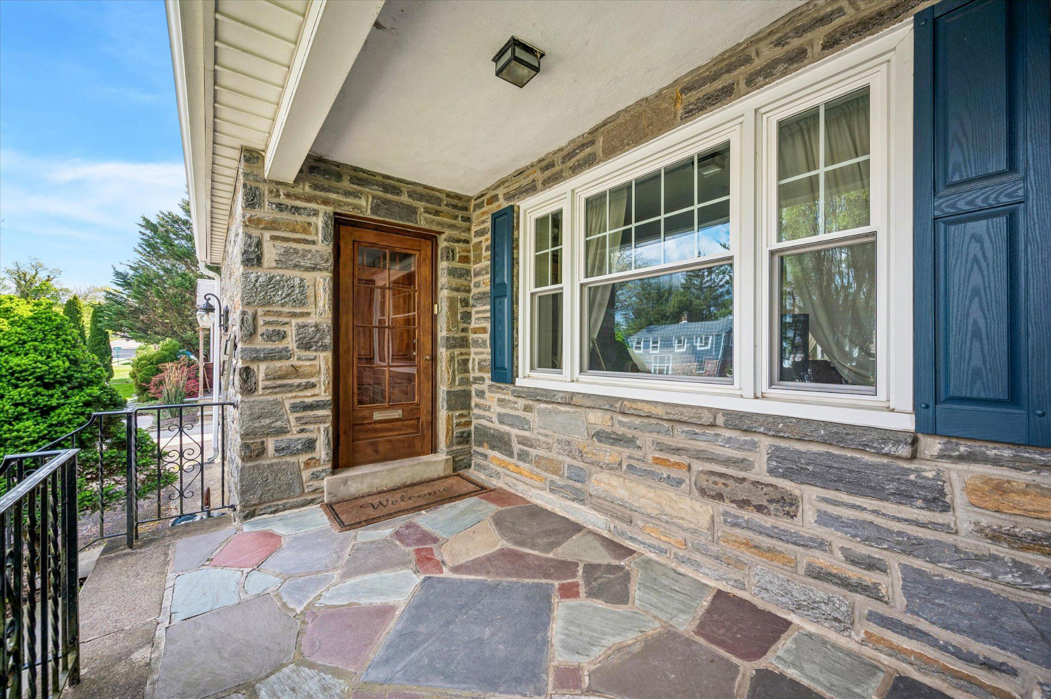Charming stone covered front porch