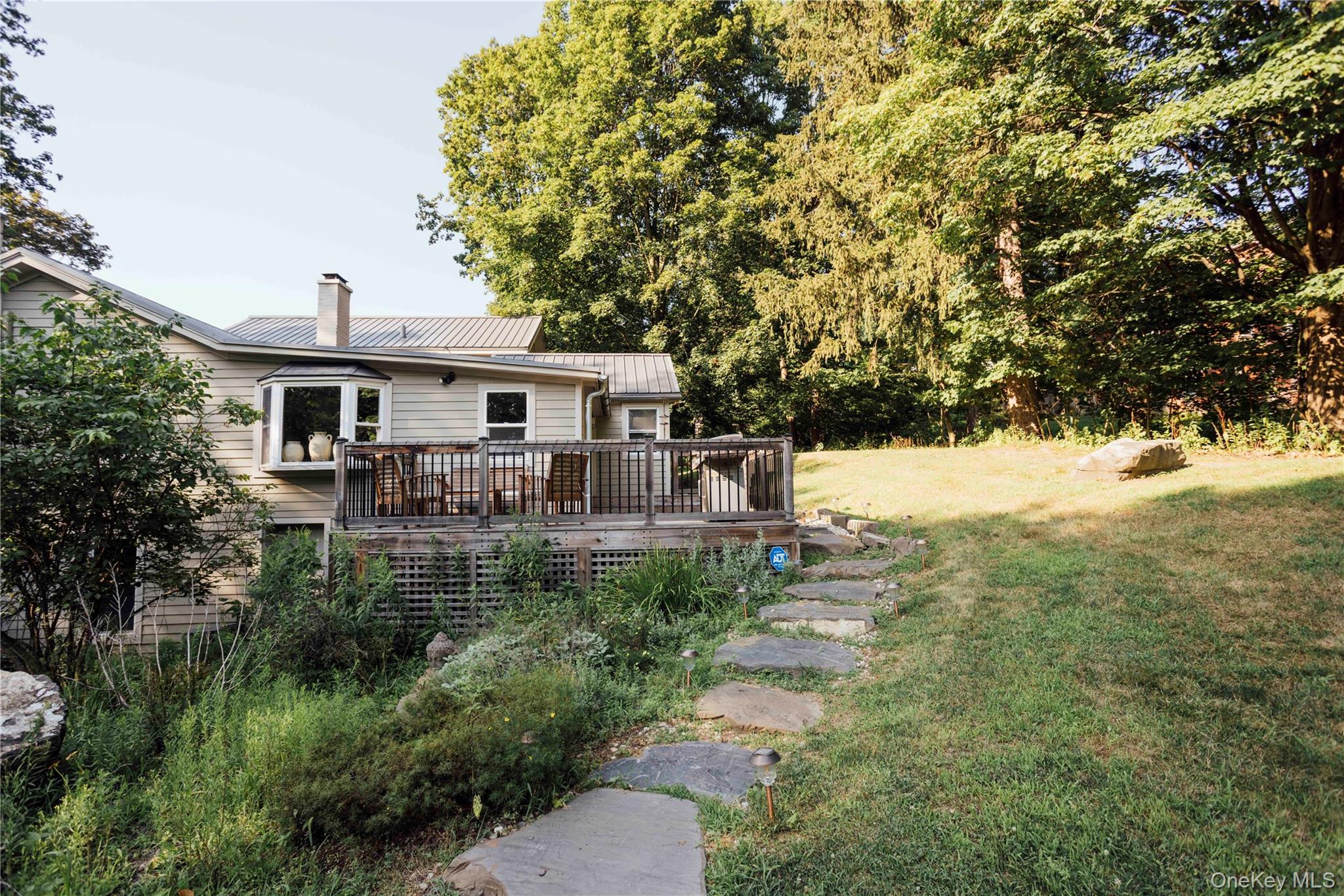 2 Locust Street Chatham, NY 12037 - Photo 18 of 29 a view of house with outdoor space and swimming pool