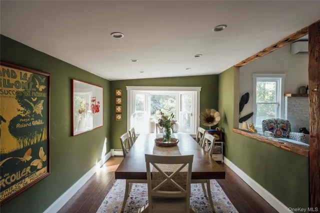 a view of a dining room with furniture window and outside view