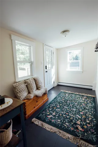 a living room with furniture and a rug