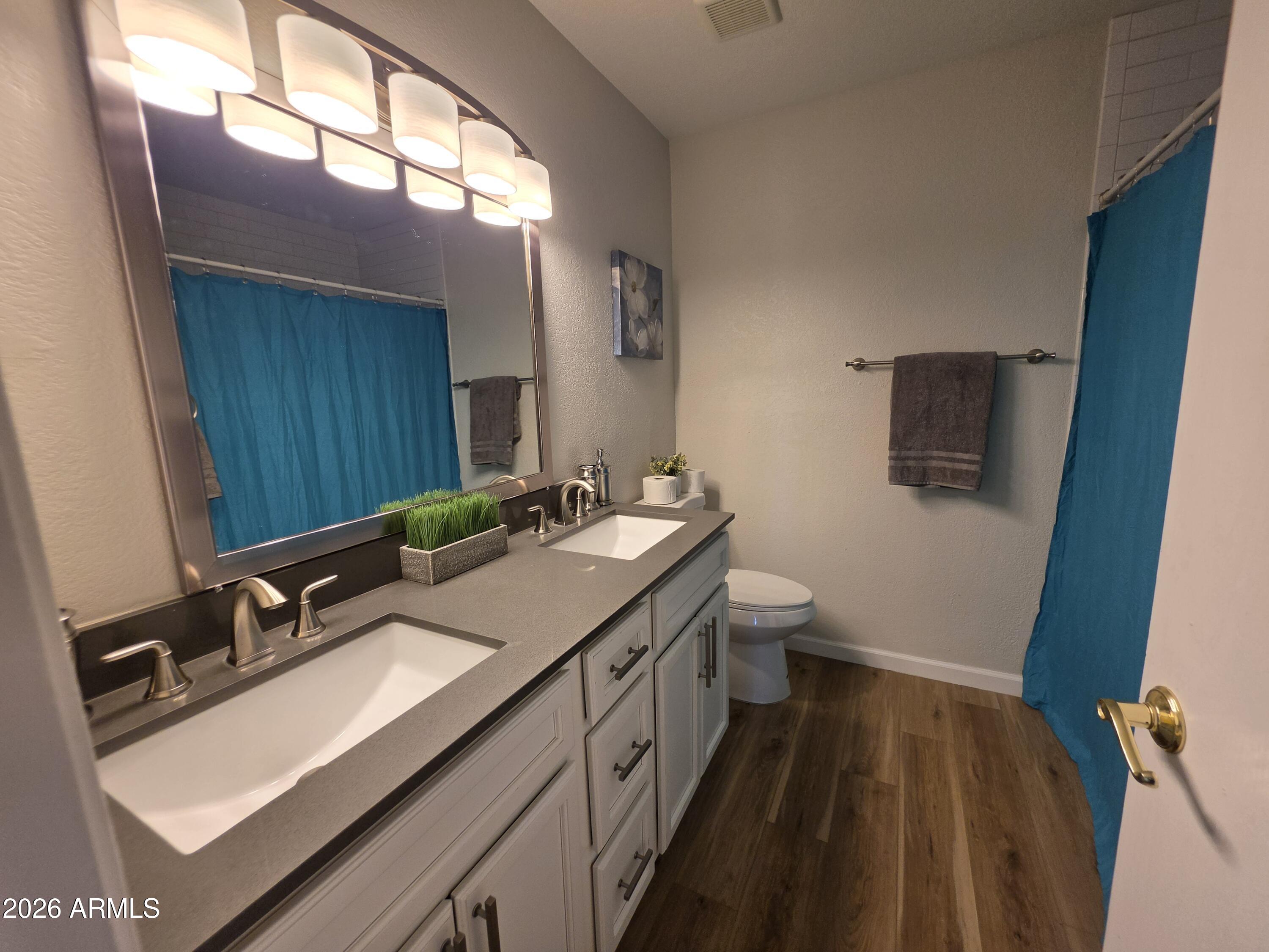 46 East McLellan Road Mesa, AZ 85201 - Photo 12 of 18 a bathroom with a sink double vanity granite and a mirror