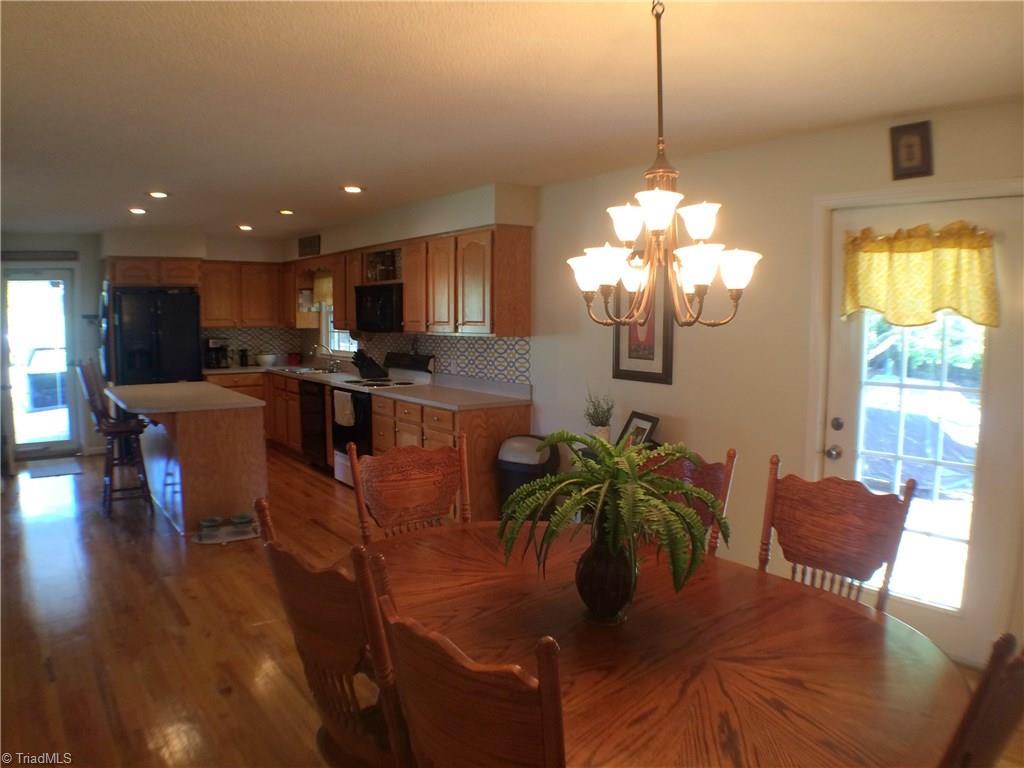 5241 Rena Road Hamptonville, NC 27020 - Photo 3 of 22 Island Bar with pull outs, Frigidaire Refrigerator, GE Stove, Kitchen aide Dishwasher & Microwave, Recessed lighting, Hardwood Flooring