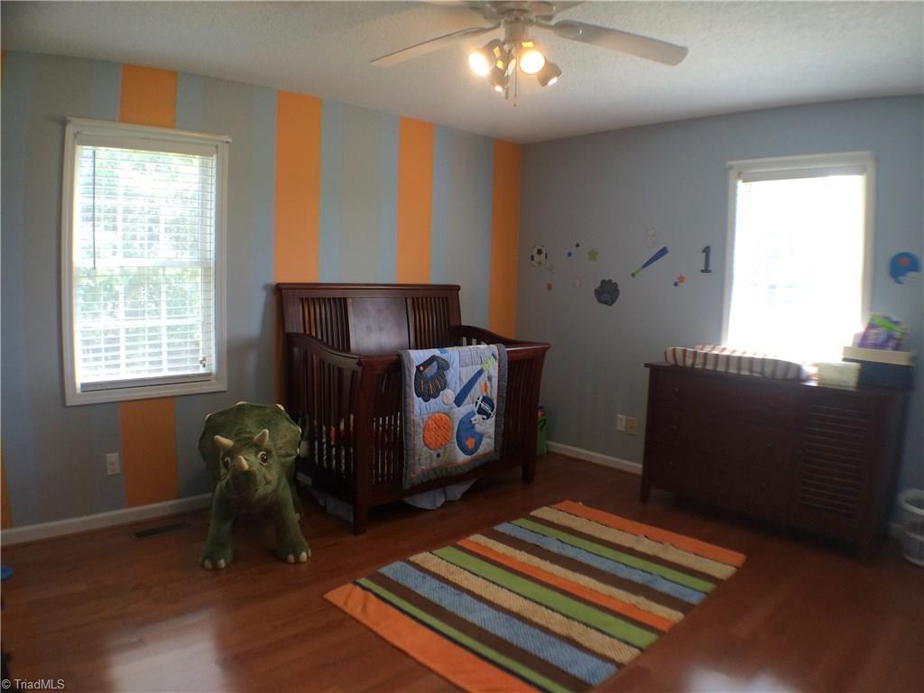 5241 Rena Road Hamptonville, NC 27020 - Photo 7 of 22 Hardwood Flooring, Ceiling Fan, and Attic Access in Reach in Closet