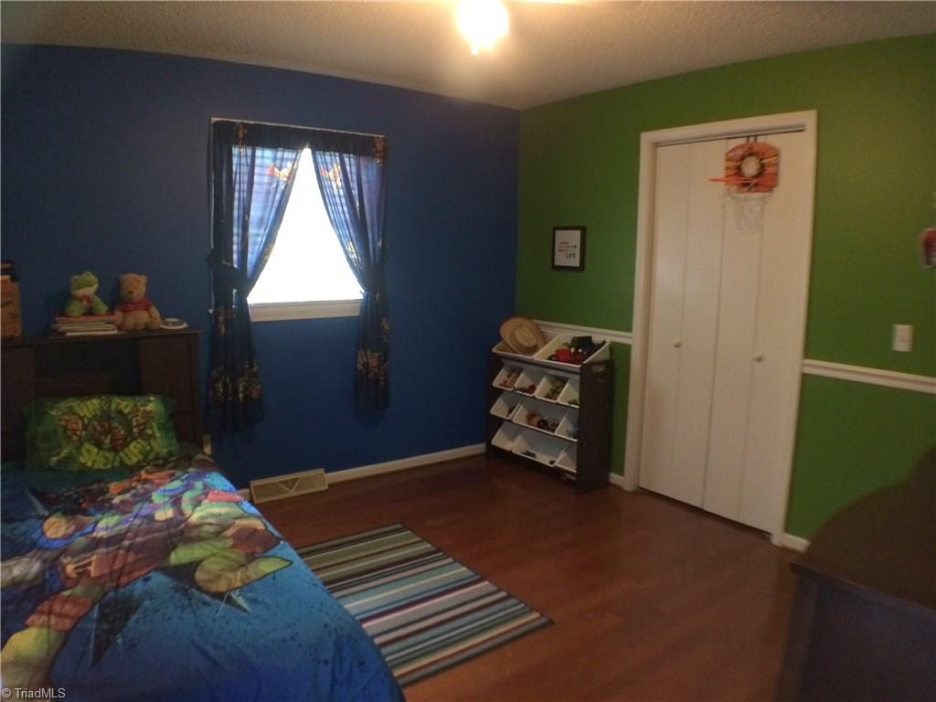 5241 Rena Road Hamptonville, NC 27020 - Photo 8 of 22 Engineered Hardwood Flooring, Ceiling Fan, and Reach In Closet.